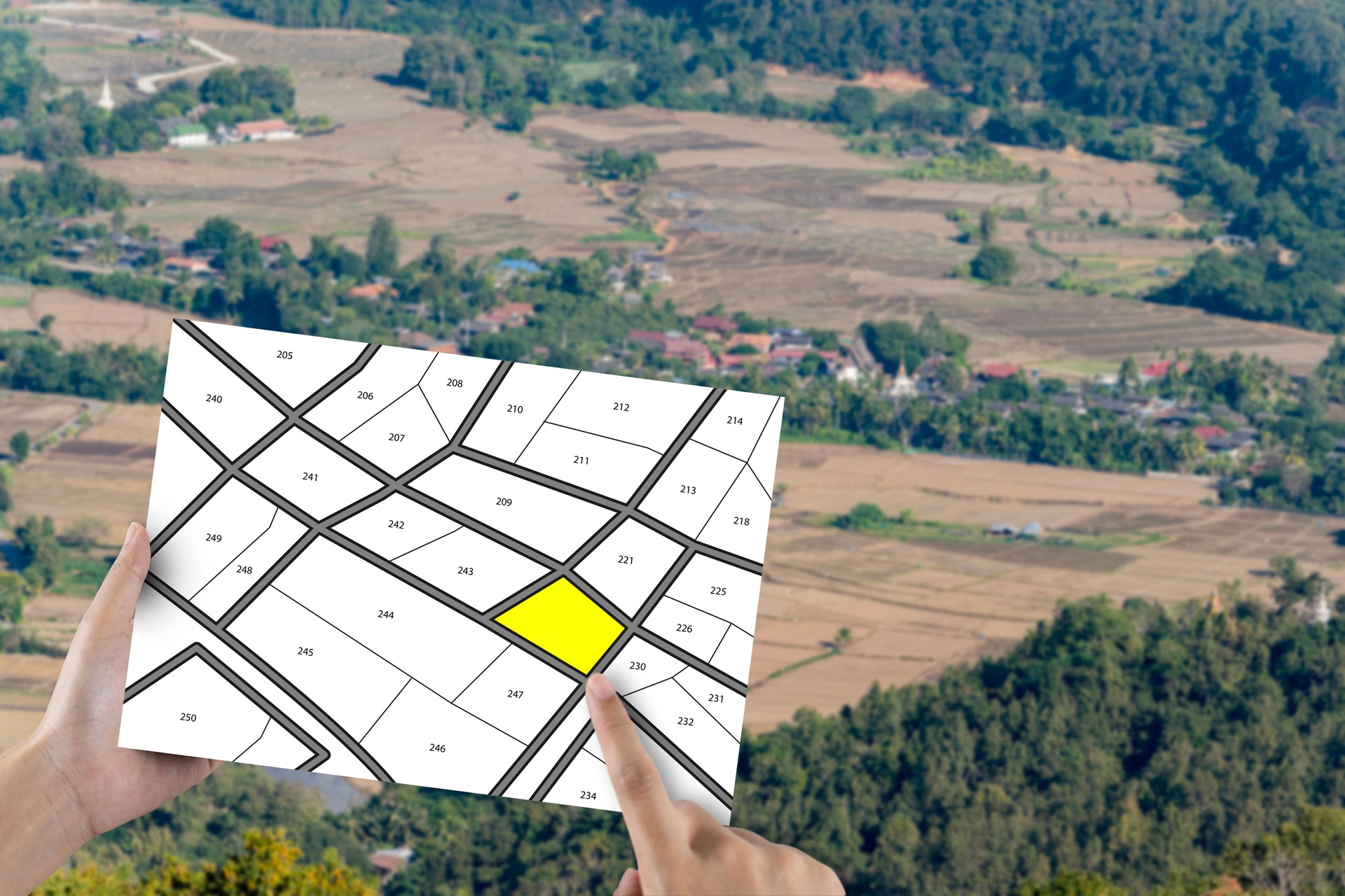 Man holding lots of land, land lot management, real estate concept with vacant land for building construction